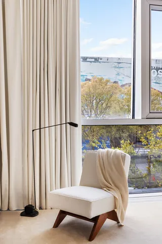 a bedroom with a bed and a couch