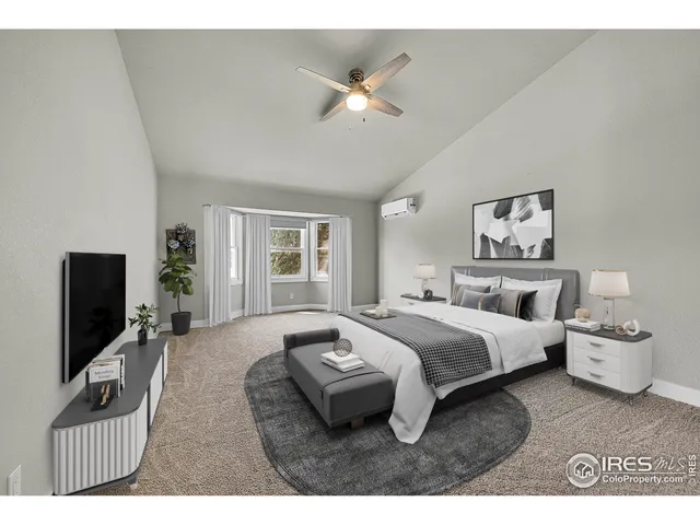 a view of an empty room and kitchen view