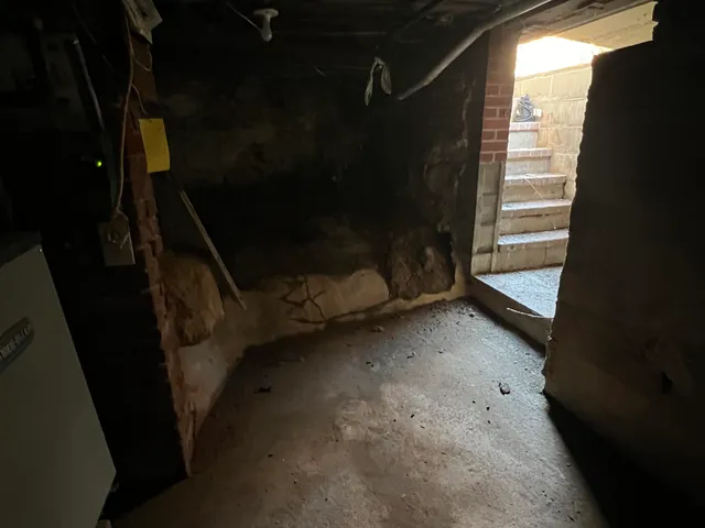 a view of a patio with table and chairs with wooden floor and plants