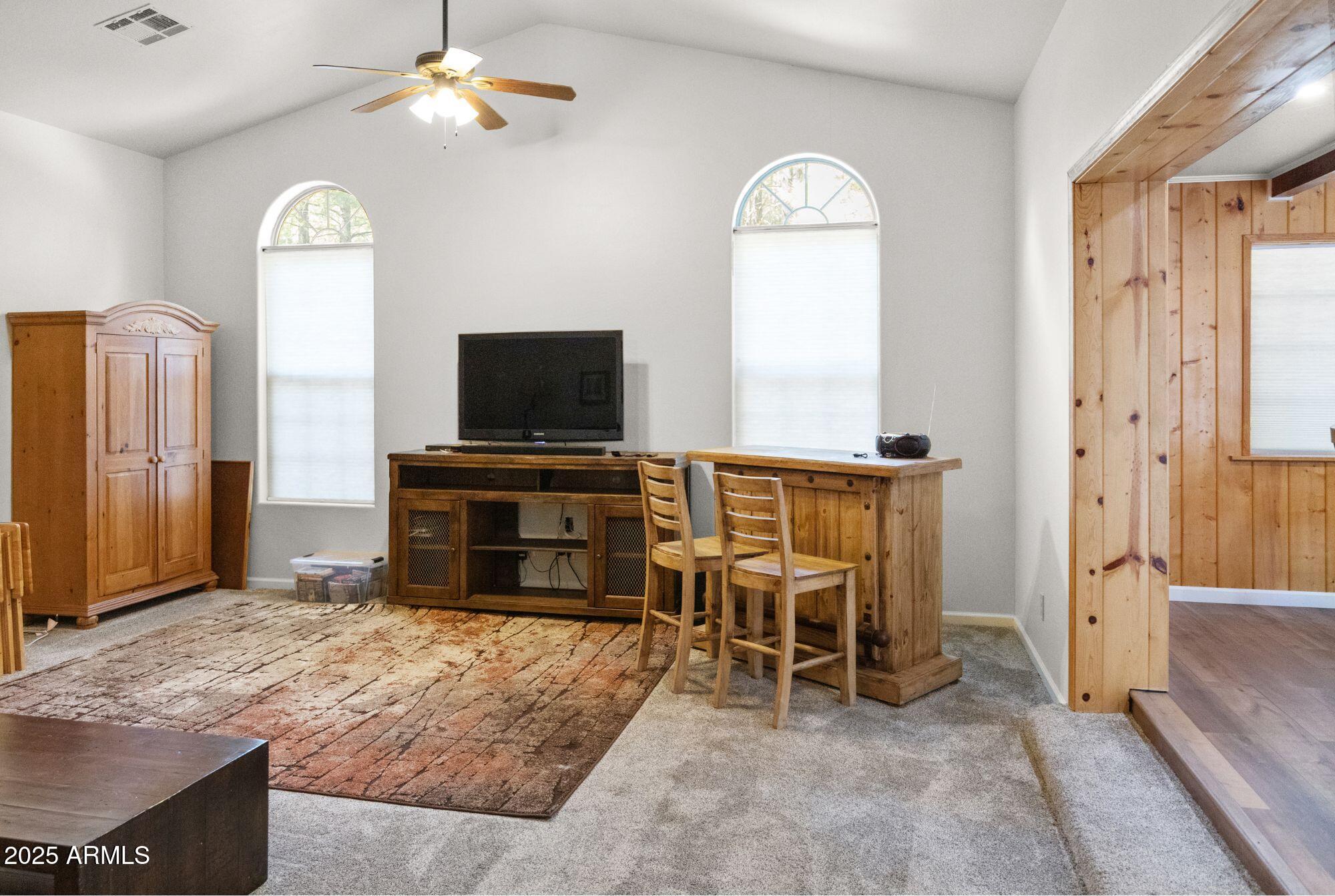 2524 Old Rim Road Forest Lakes, AZ 85931 - Photo 21 of 44 a view of a livingroom with furniture and a flat screen tv