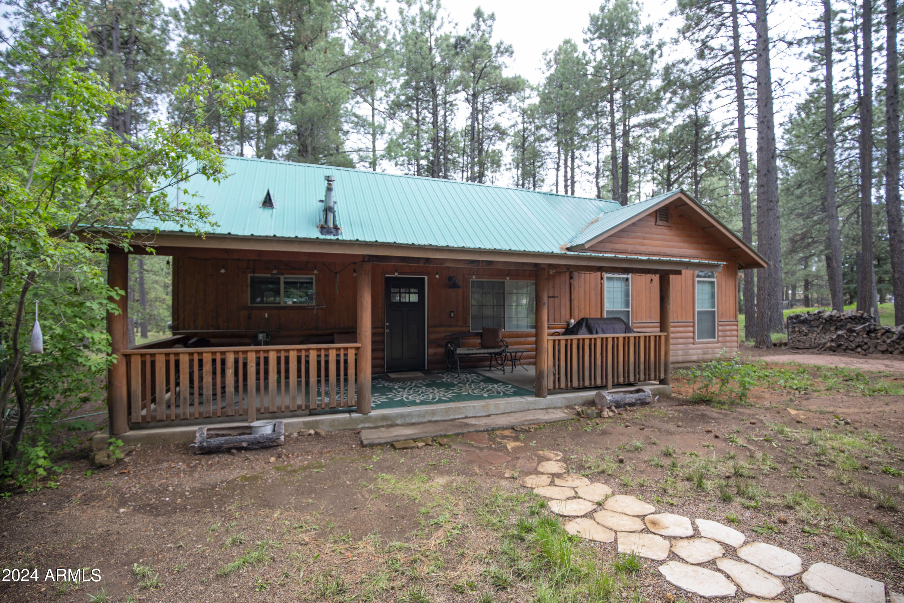 2524 Old Rim Road Forest Lakes, AZ 85931 - Photo 31 of 44 a front view of a house with garden
