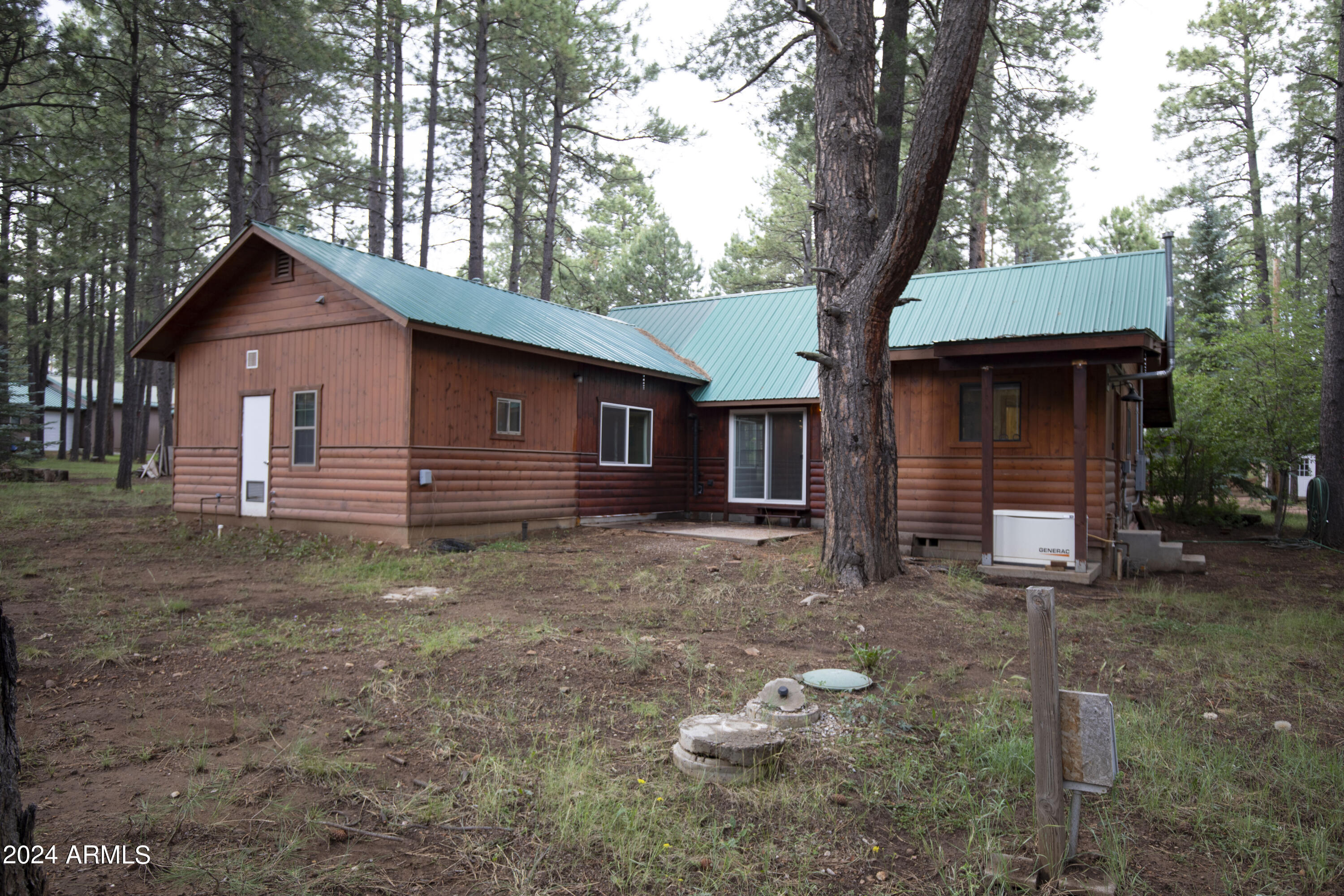 2524 Old Rim Road Forest Lakes, AZ 85931 - Photo 32 of 44 a front view of a house with garden
