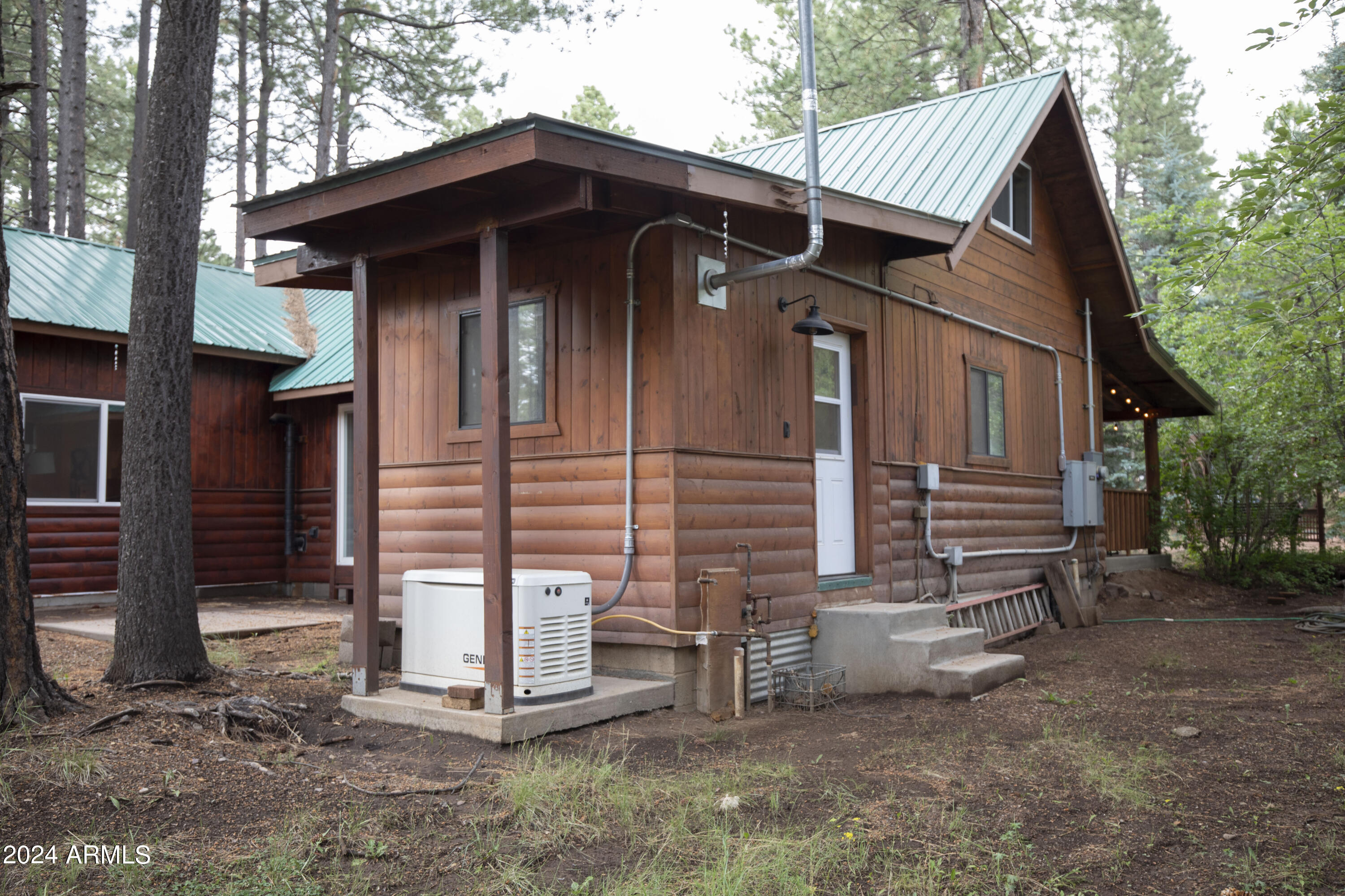 2524 Old Rim Road Forest Lakes, AZ 85931 - Photo 34 of 44 a front view of a house with garden