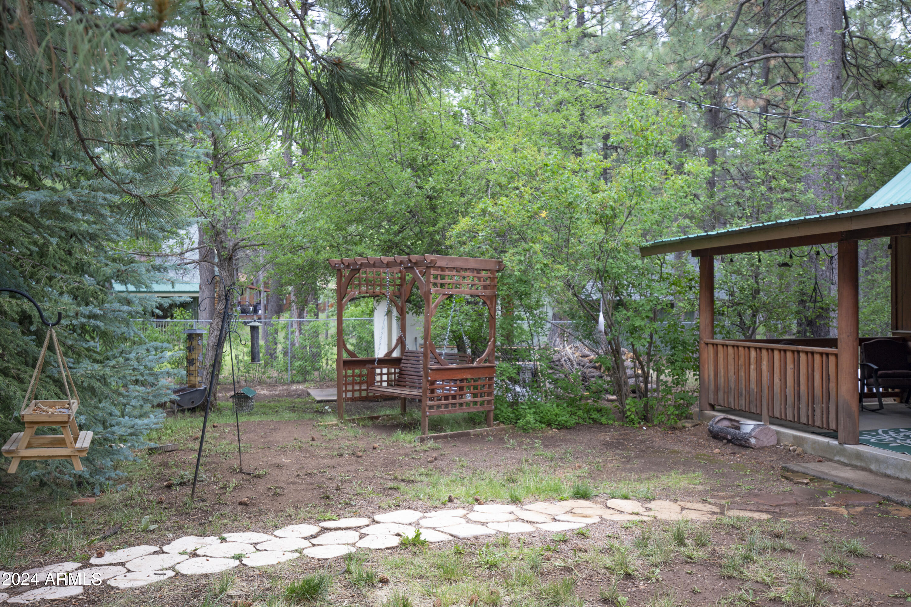2524 Old Rim Road Forest Lakes, AZ 85931 - Photo 36 of 44 a backyard of a house with barbeque oven and outdoor seating