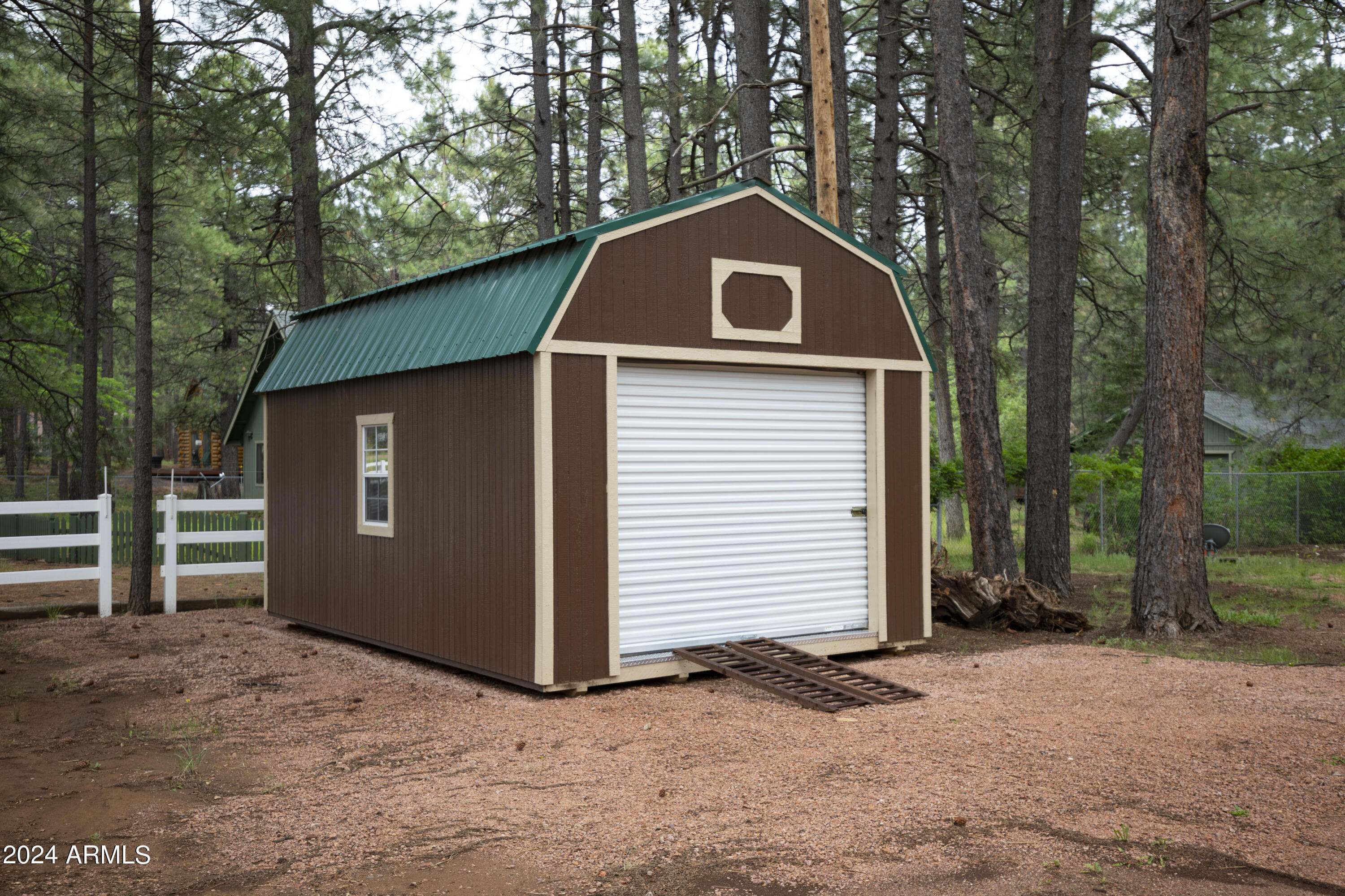 2524 Old Rim Road Forest Lakes, AZ 85931 - Photo 39 of 44 a front view of a house with a yard and garage