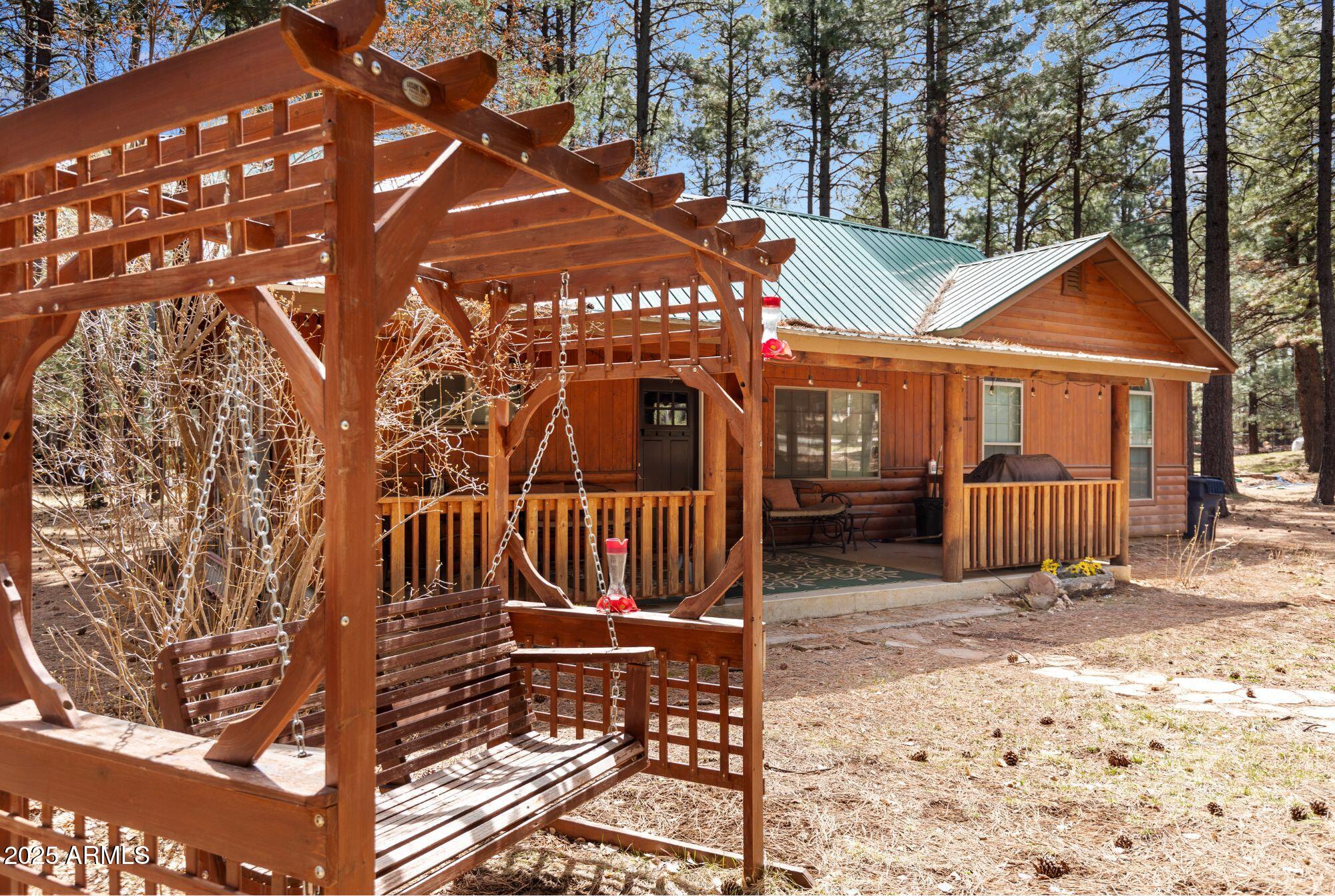 2524 Old Rim Road Forest Lakes, AZ 85931 - Photo 4 of 44 a view of a house with wooden fence