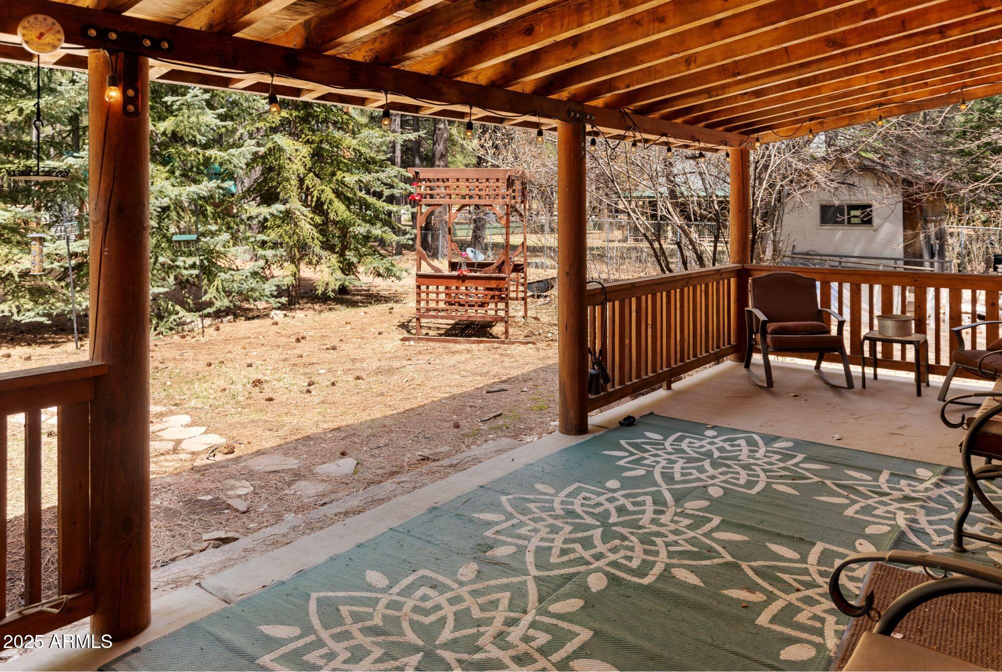 2524 Old Rim Road Forest Lakes, AZ 85931 - Photo 10 of 44 a view of a porch with wooden floor