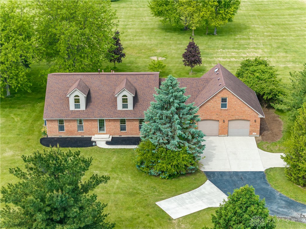 9981 Ridge Acres Lane Englewood, OH 45322 - Photo 65 of 73 This classic brick residence boasts ample parking and verdant surroundings.