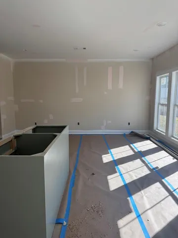 a kitchen with a sink and a stove top oven
