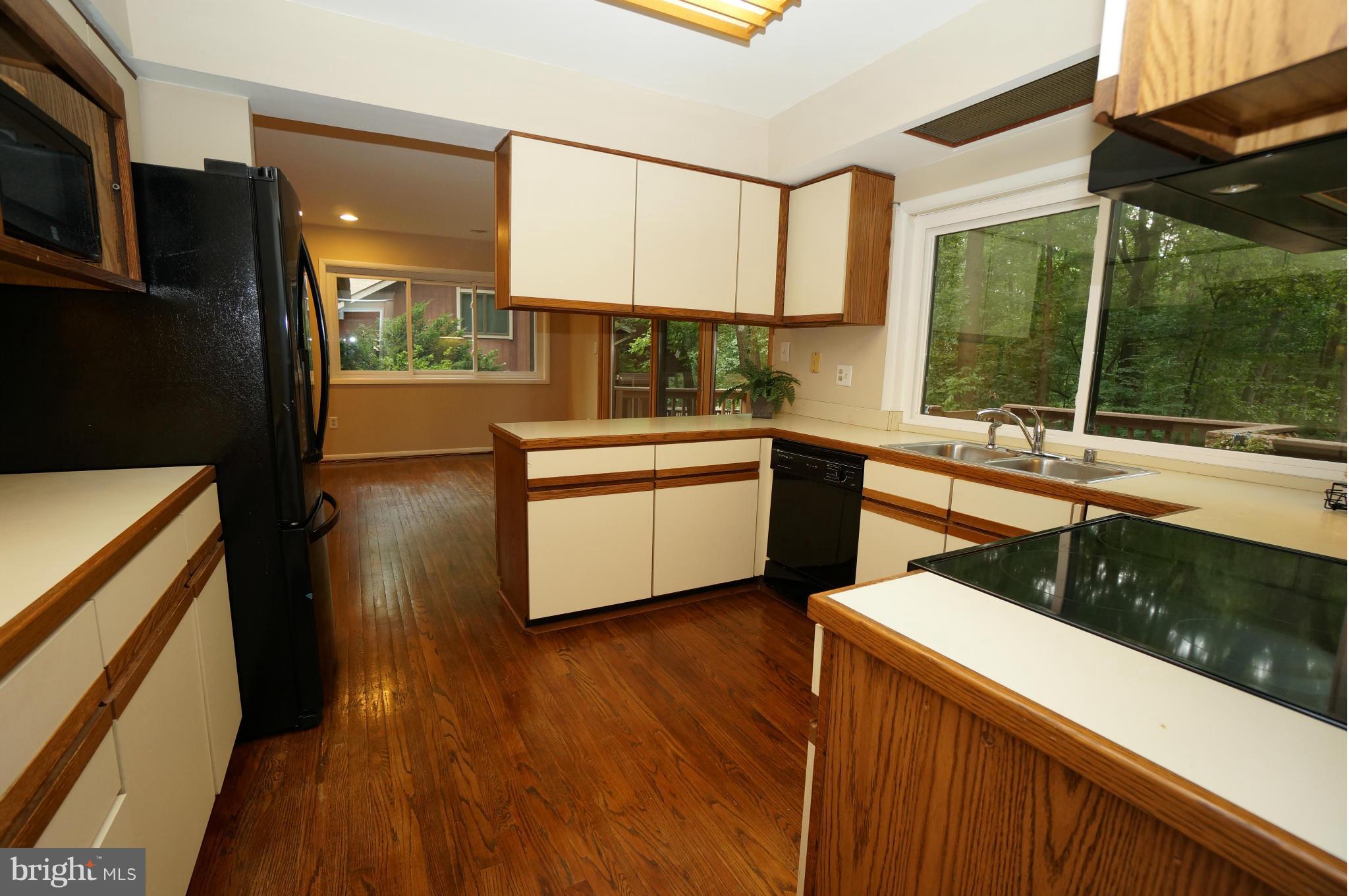10975 Swansfield Road Columbia, MD 21044 - Photo 17 of 30 Kitchen to Family Room