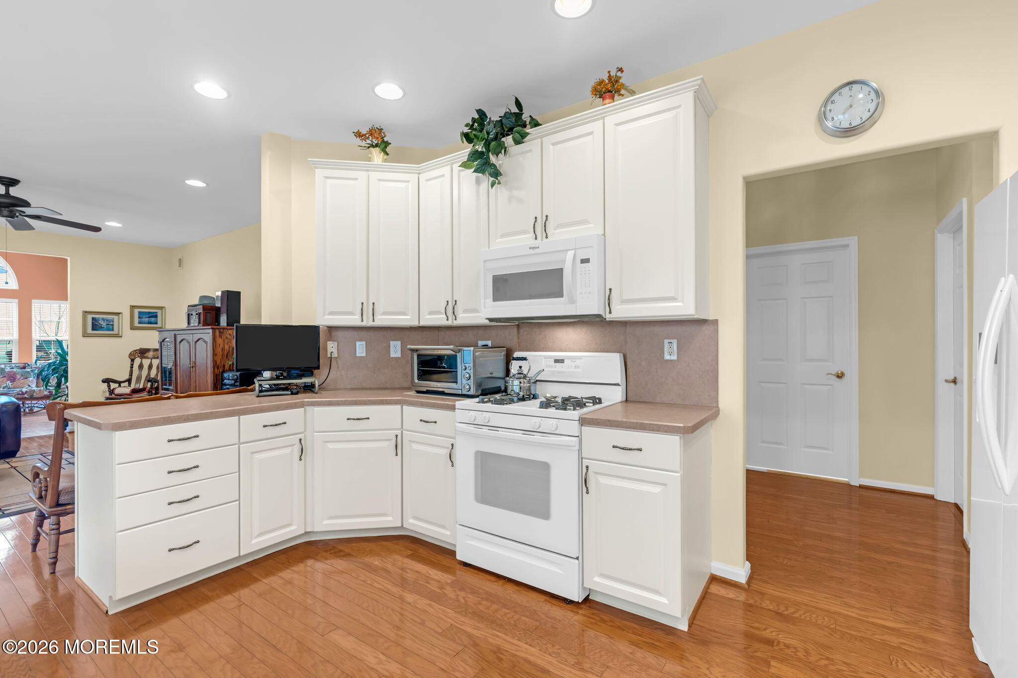 17 Rochford Drive Manchester Township, NJ 08759 - Photo 18 of 55 a kitchen with stainless steel appliances white cabinets and wooden floors
