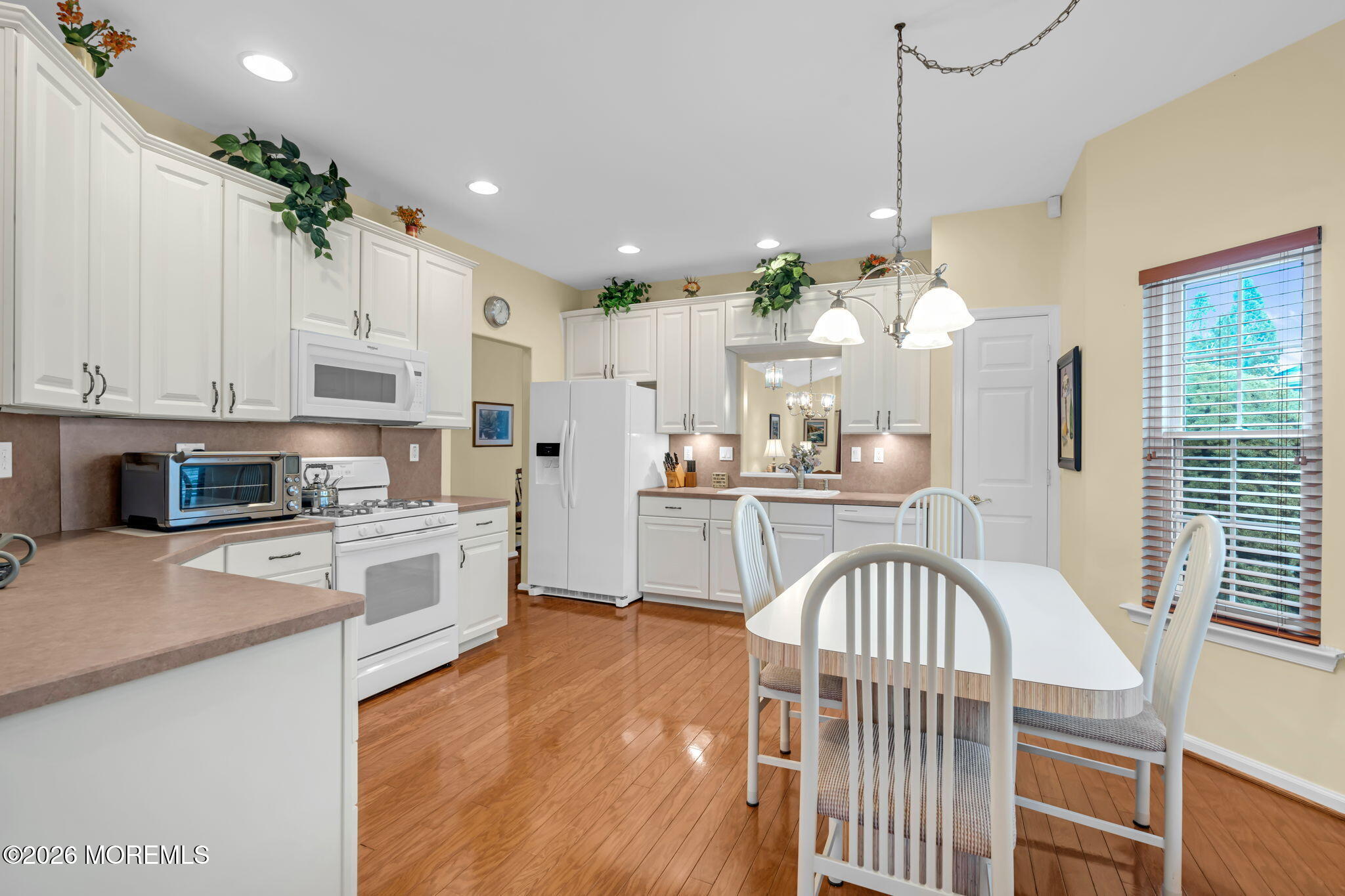 17 Rochford Drive Manchester Township, NJ 08759 - Photo 19 of 55 a kitchen with kitchen island stainless steel appliances sink cabinets and window