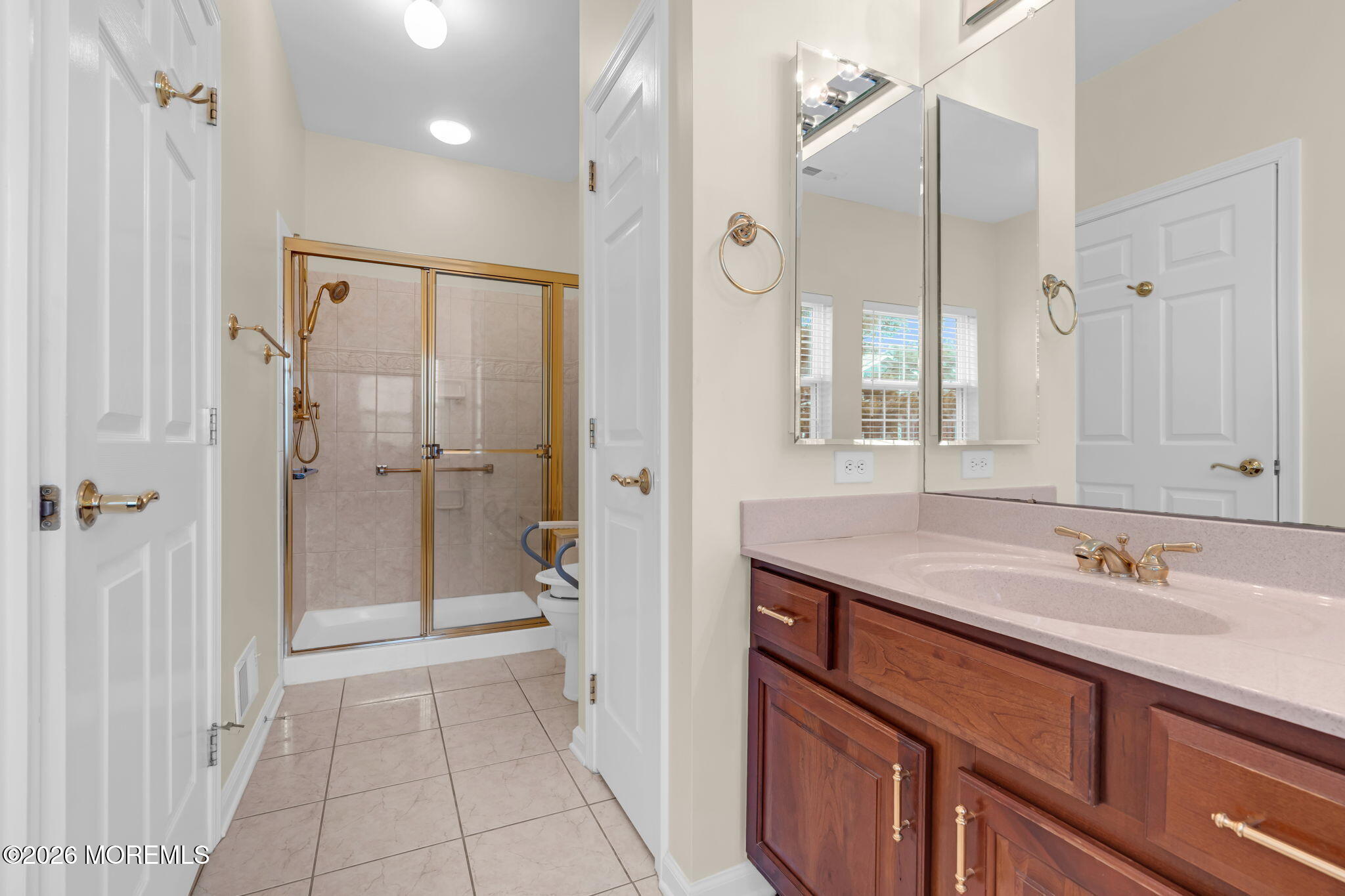 17 Rochford Drive Manchester Township, NJ 08759 - Photo 33 of 55 a bathroom with a sink a toilet and shower
