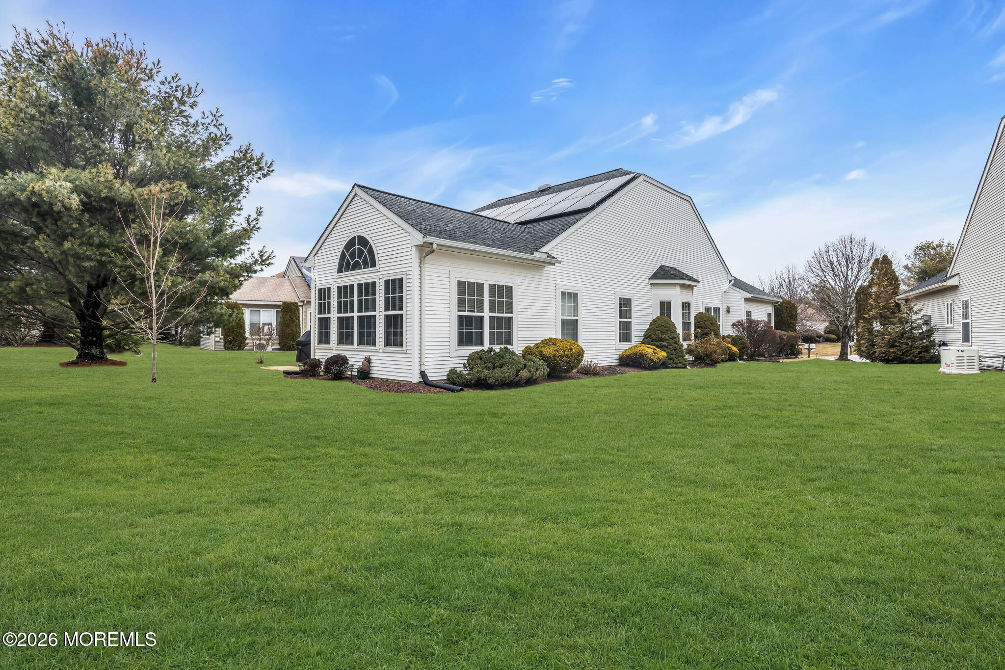 17 Rochford Drive Manchester Township, NJ 08759 - Photo 34 of 55 a view of a house with a big yard and large trees