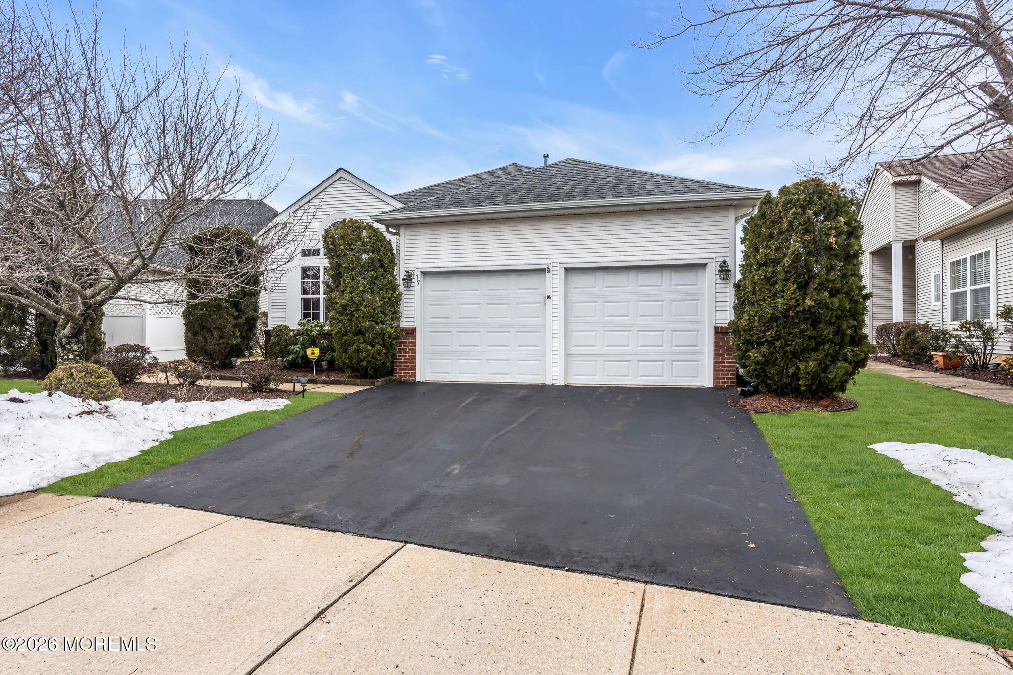 17 Rochford Drive Manchester Township, NJ 08759 - Photo 4 of 55 a front view of a house with a yard and garage