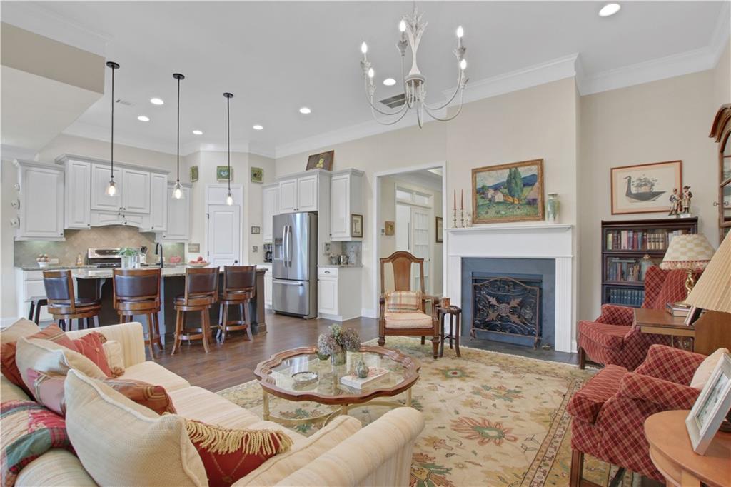 407 Windy Ridge Way Canton, GA 30114 - Photo 15 of 57 a living room with furniture kitchen and a fireplace