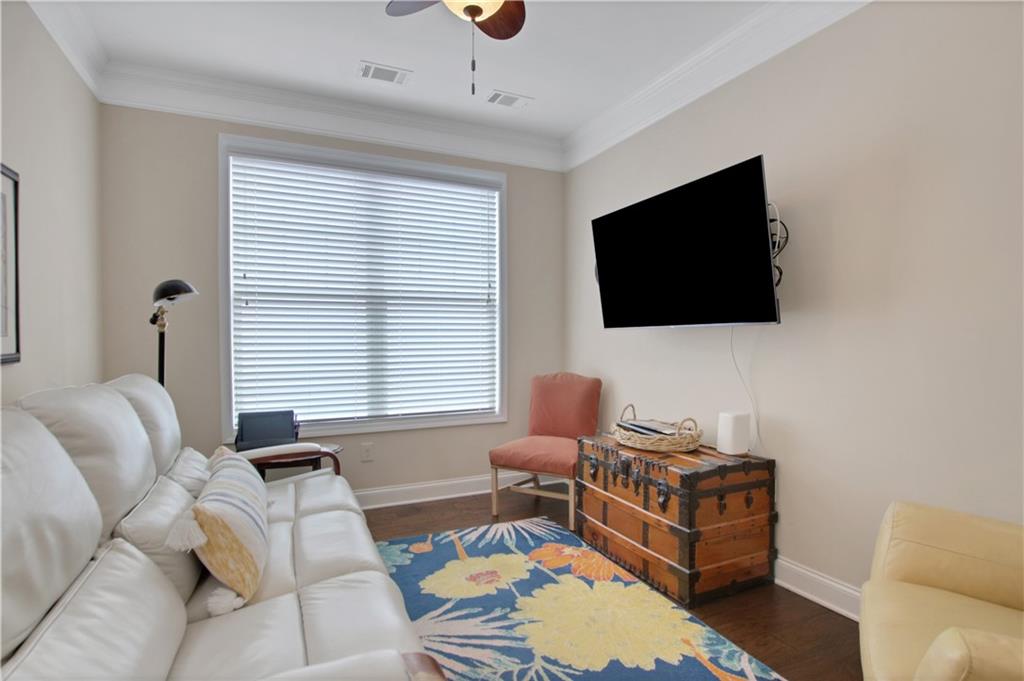 407 Windy Ridge Way Canton, GA 30114 - Photo 17 of 57 a living room with furniture and a flat screen tv