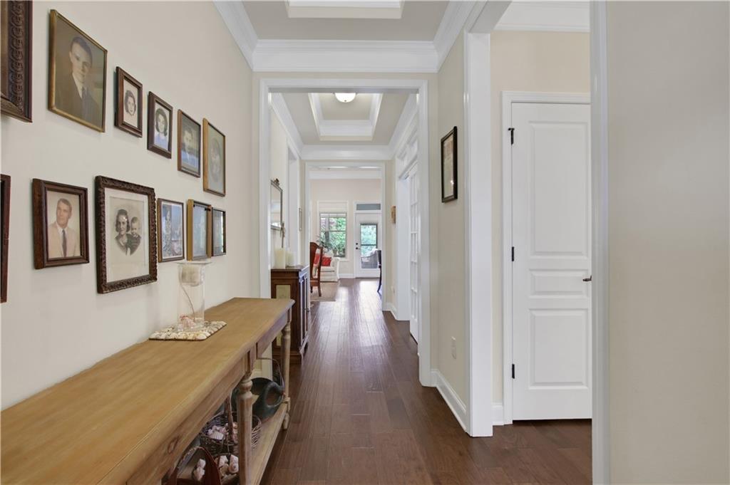 407 Windy Ridge Way Canton, GA 30114 - Photo 19 of 57 a view of a hallway with furniture and wooden floor