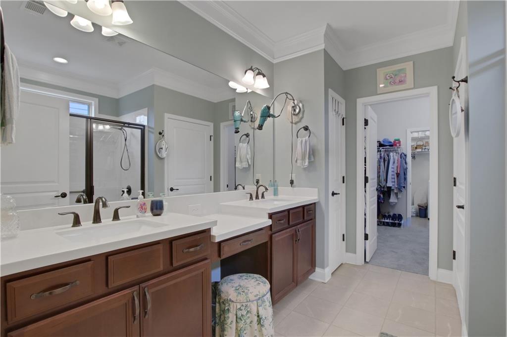 407 Windy Ridge Way Canton, GA 30114 - Photo 27 of 57 a spacious bathroom with a double vanity sink mirror and double
