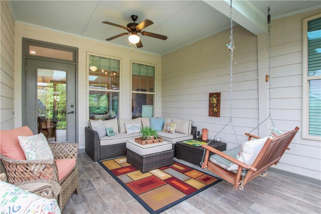 407 Windy Ridge Way Canton, GA 30114 - Photo 34 of 57 a living room with patio a couch and a potted plant