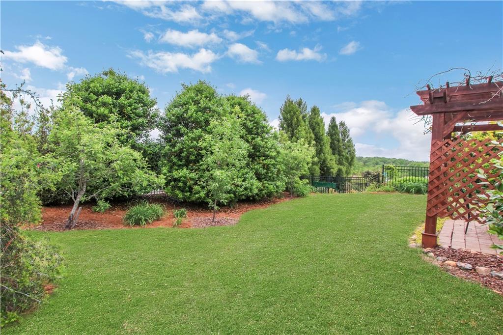407 Windy Ridge Way Canton, GA 30114 - Photo 35 of 57 a view of a backyard of the house