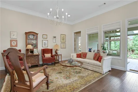 a living room with furniture kitchen and a fireplace