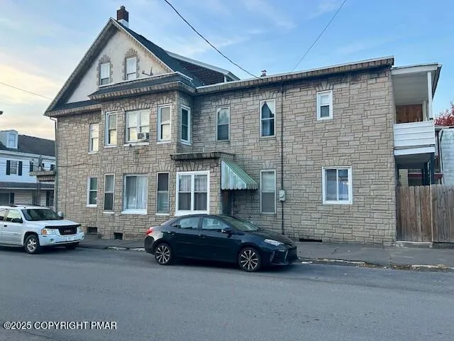 a car parked in front of a house