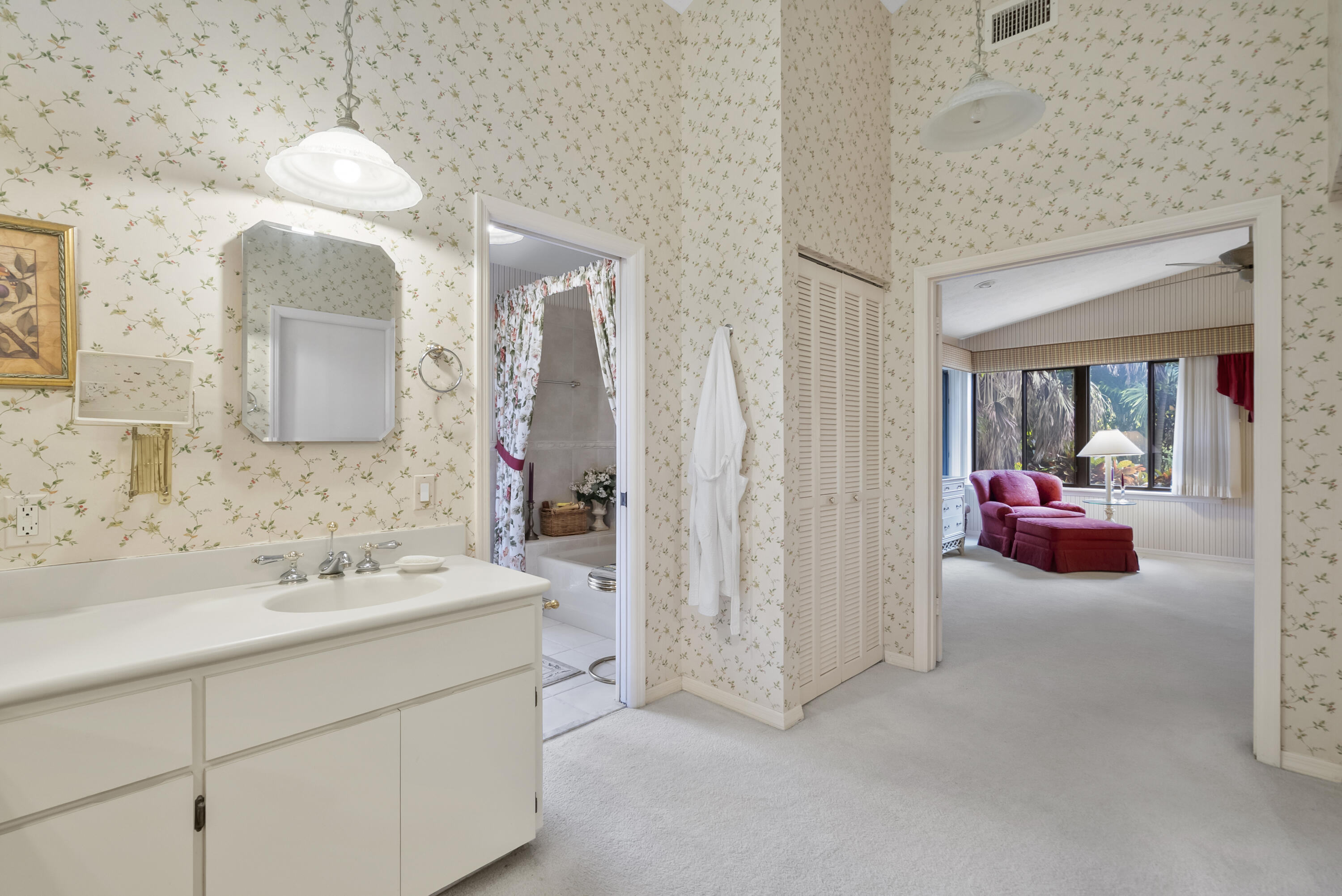 5011 Southeast Burning Tree Circle Stuart, FL 34997 - Photo 27 of 59 a en suite bathroom with a double vanity sink mirror and