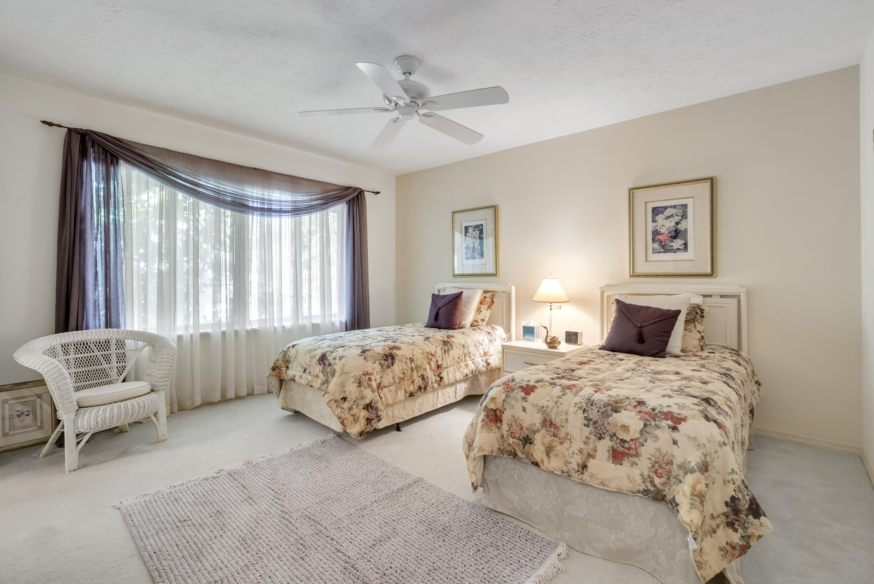 5011 Southeast Burning Tree Circle Stuart, FL 34997 - Photo 35 of 59 a bedroom with two beds and a couch