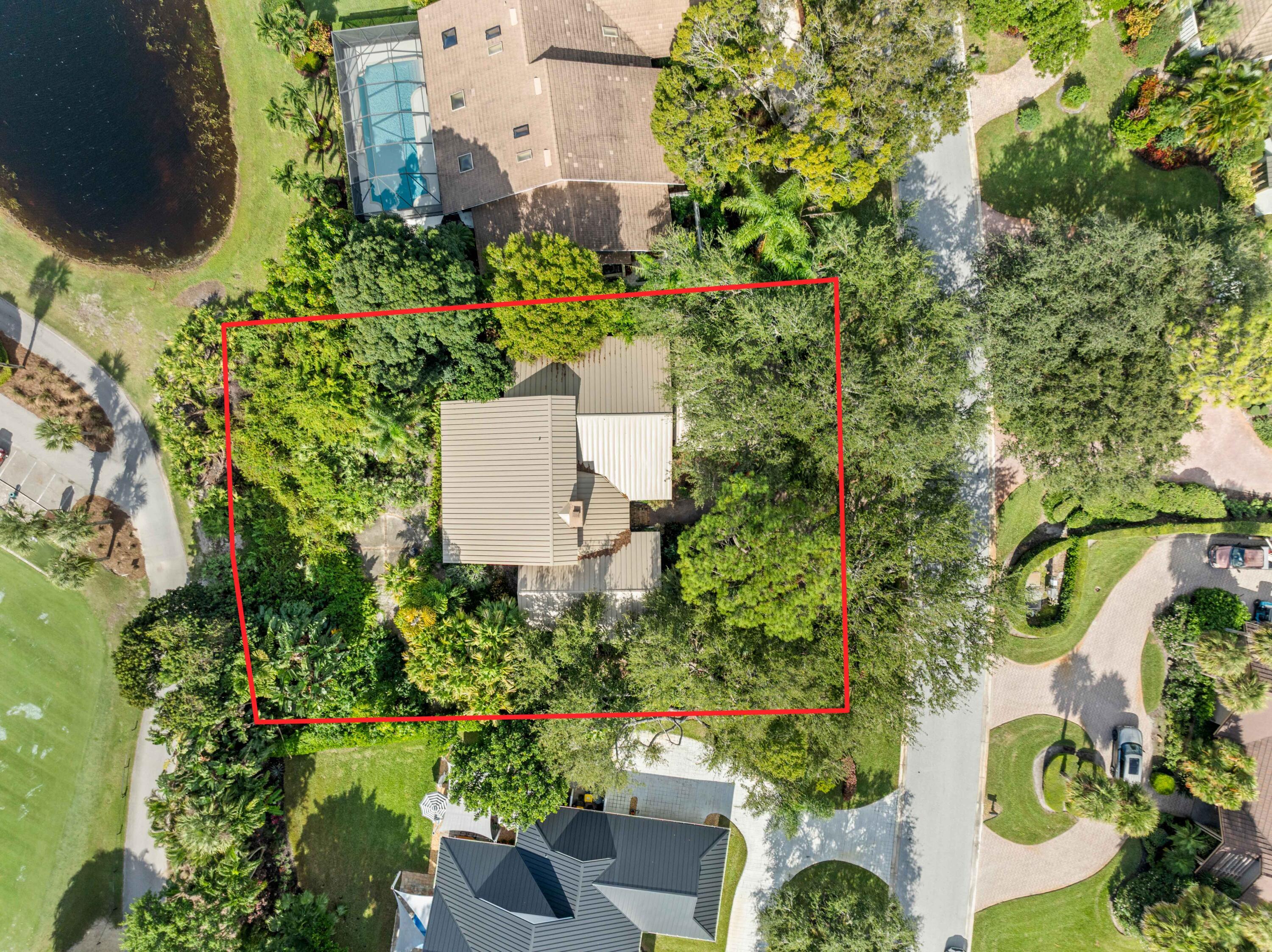 5011 Southeast Burning Tree Circle Stuart, FL 34997 - Photo 5 of 59 an aerial view of a house with a garden