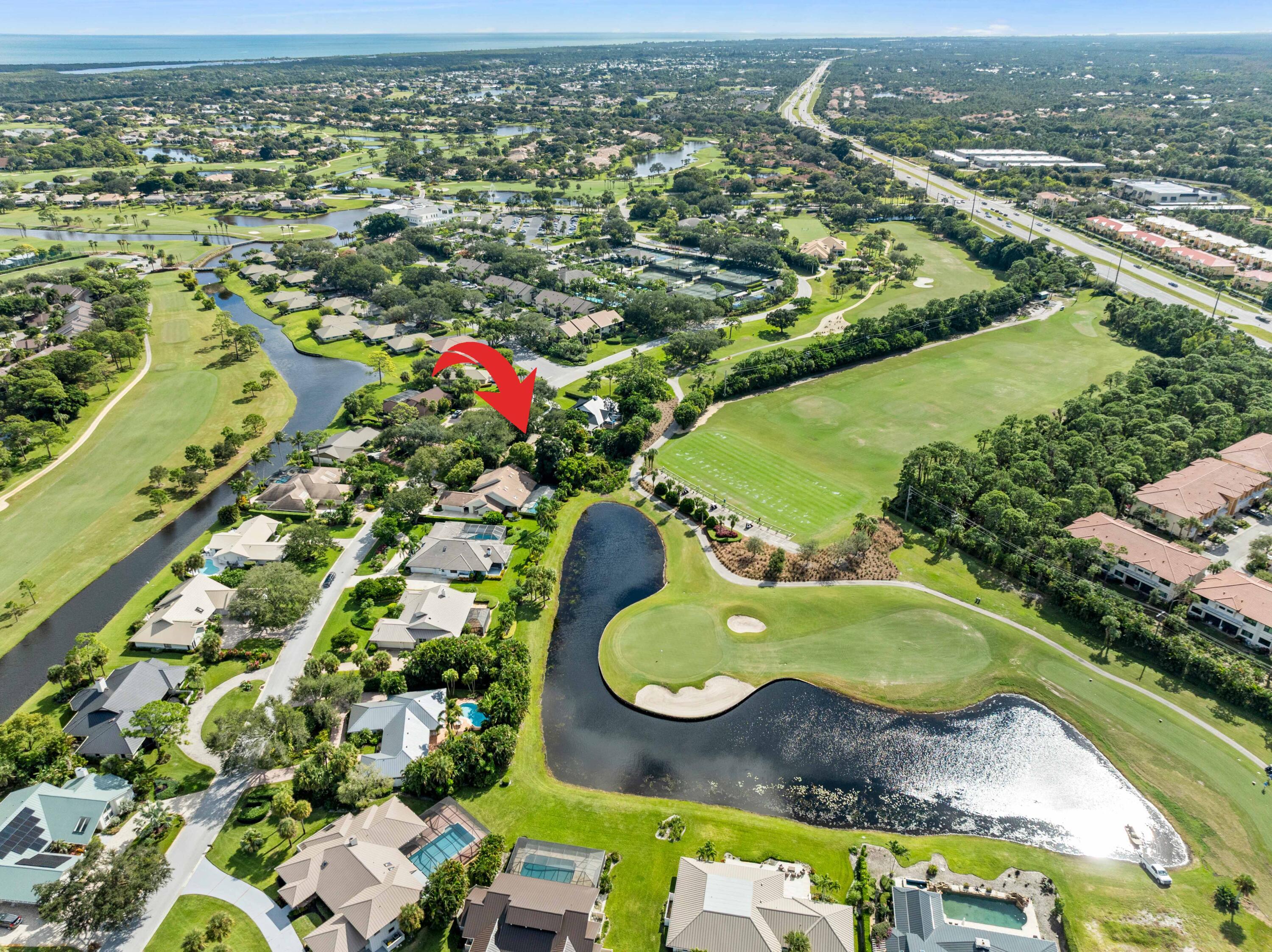 5011 Southeast Burning Tree Circle Stuart, FL 34997 - Photo 6 of 59 an aerial view of residential house with outdoor space