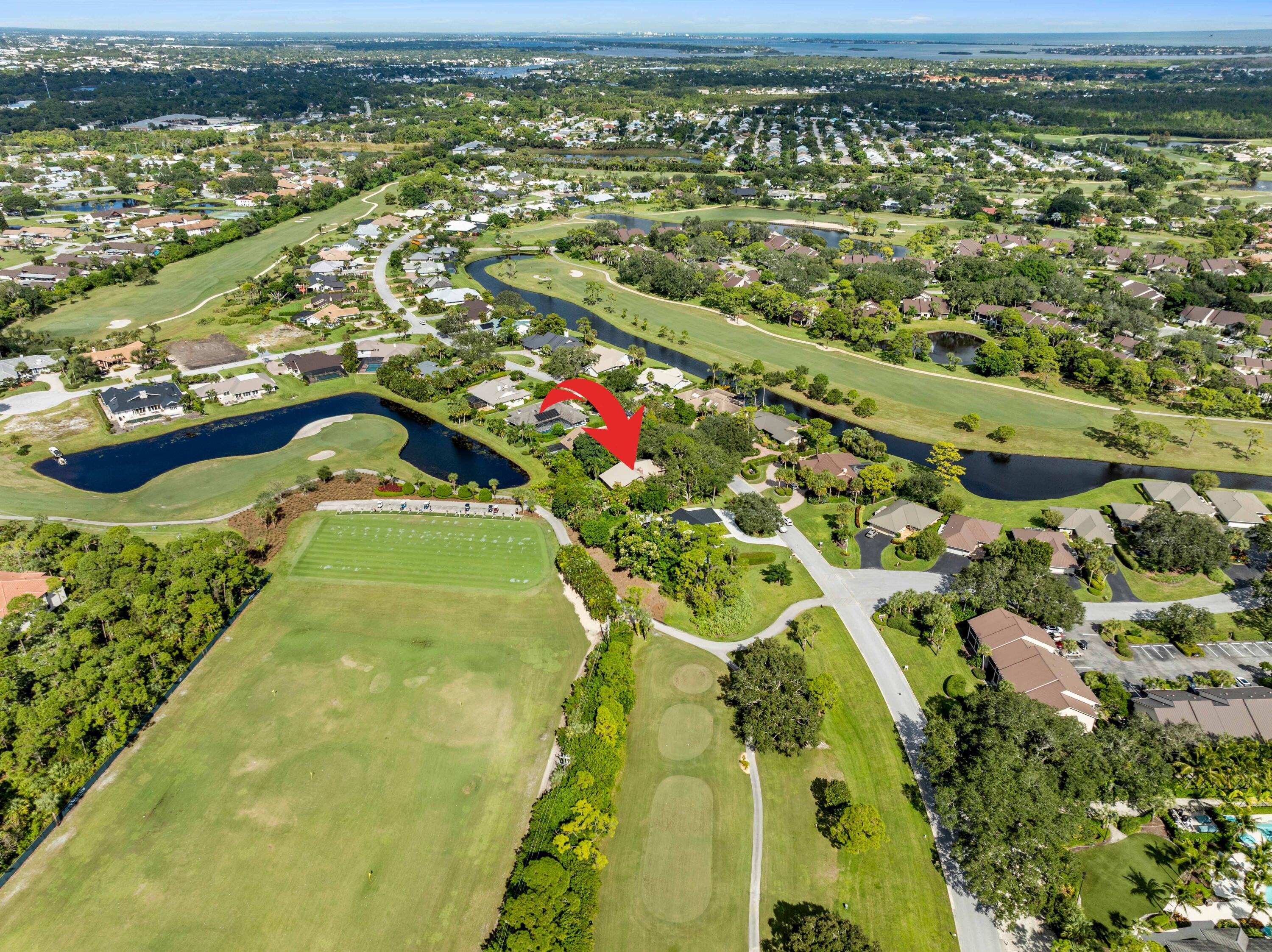 5011 Southeast Burning Tree Circle Stuart, FL 34997 - Photo 7 of 59 an aerial view of residential houses with outdoor space and river