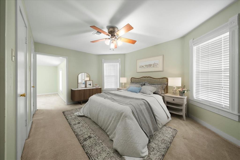 101 North 7th Street Krum, TX 76249 - Photo 14 of 26 Carpeted bedroom with ceiling fan and baseboards