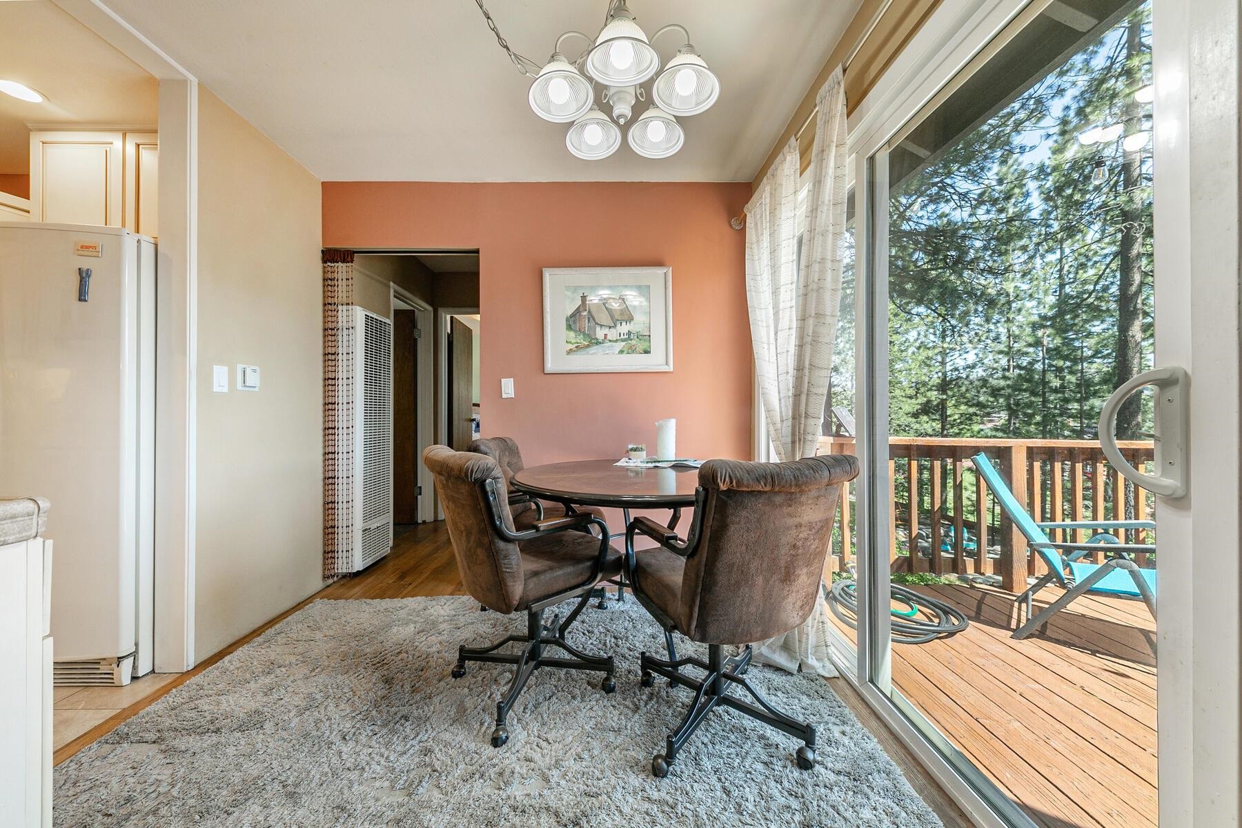 11629 Brook Lane Truckee, CA 96161 - Photo 12 of 28 a view of a dining room with furniture window and wooden floor