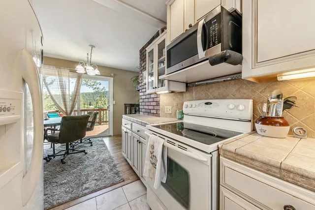 a kitchen with a stove and a refrigerator