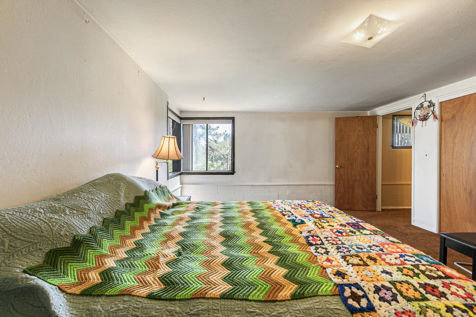 11629 Brook Lane Truckee, CA 96161 - Photo 24 of 28 a bedroom with a bed and a window