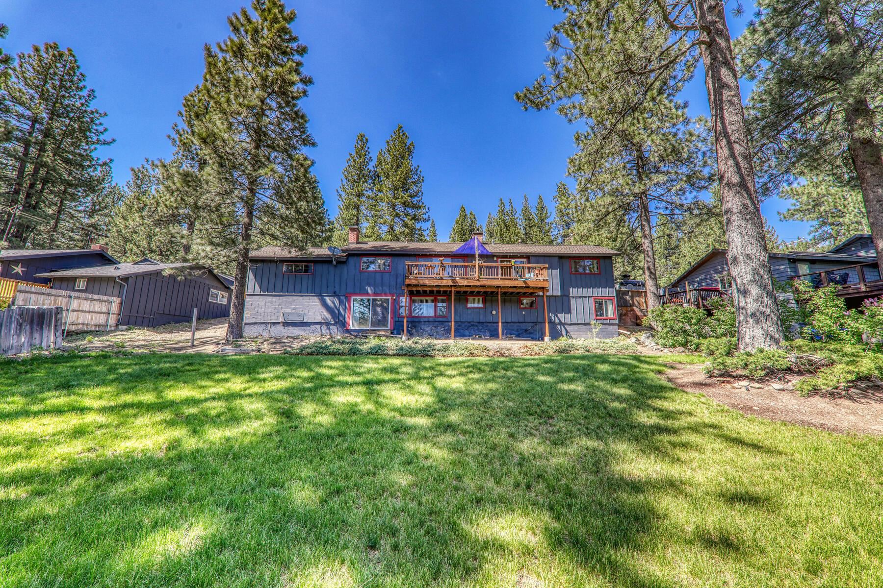 11629 Brook Lane Truckee, CA 96161 - Photo 28 of 28 a view of a backyard with wooden fence and a large tree