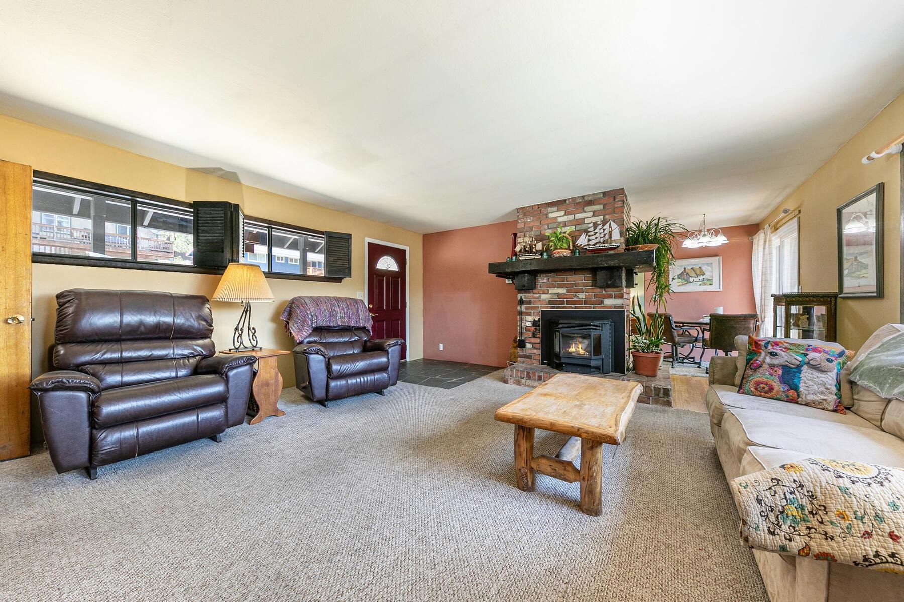 11629 Brook Lane Truckee, CA 96161 - Photo 9 of 28 a living room with furniture a fireplace and a flat screen tv
