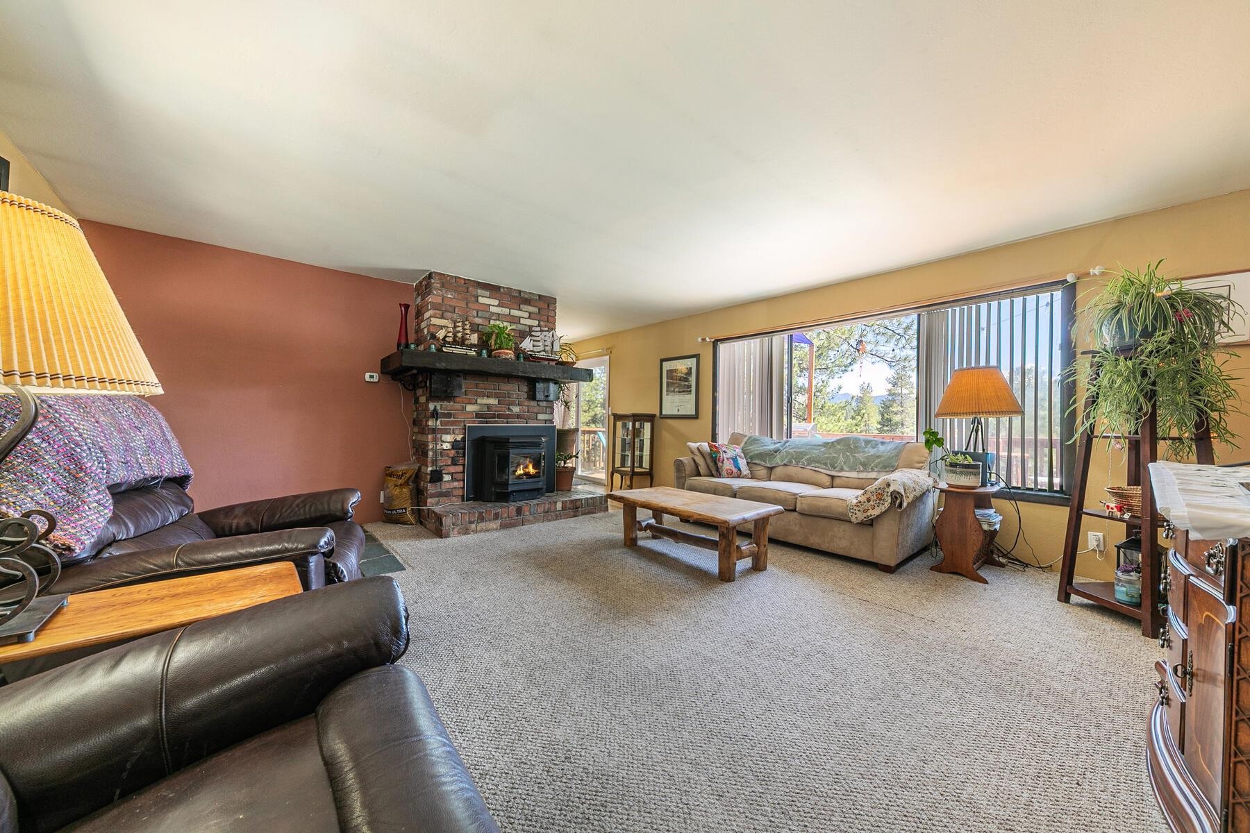 11629 Brook Lane Truckee, CA 96161 - Photo 10 of 28 a living room with furniture and a fireplace