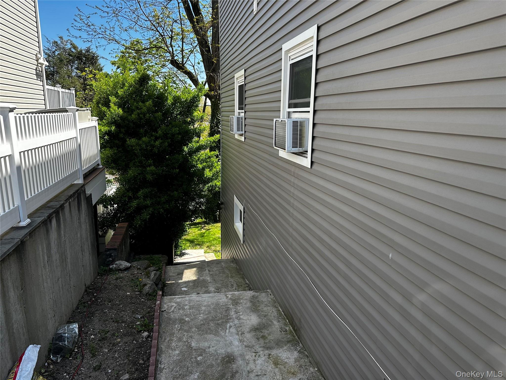56 Marwood Road North, Unit 2 Port Washington, NY 11050 - Photo 10 of 11 a view of a pathway of a house