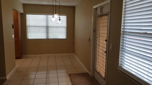 a view of an empty room and window