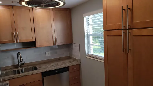 a kitchen with a sink and cabinets