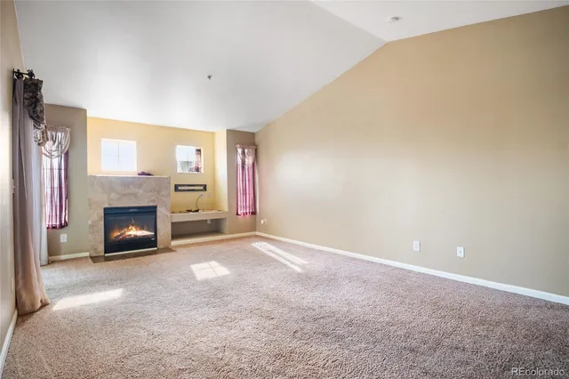 a view of a livingroom with a fireplace and a fireplace
