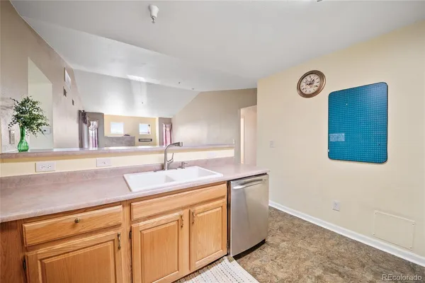 a room with cabinets and sink