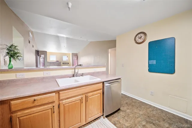 a room with cabinets and sink