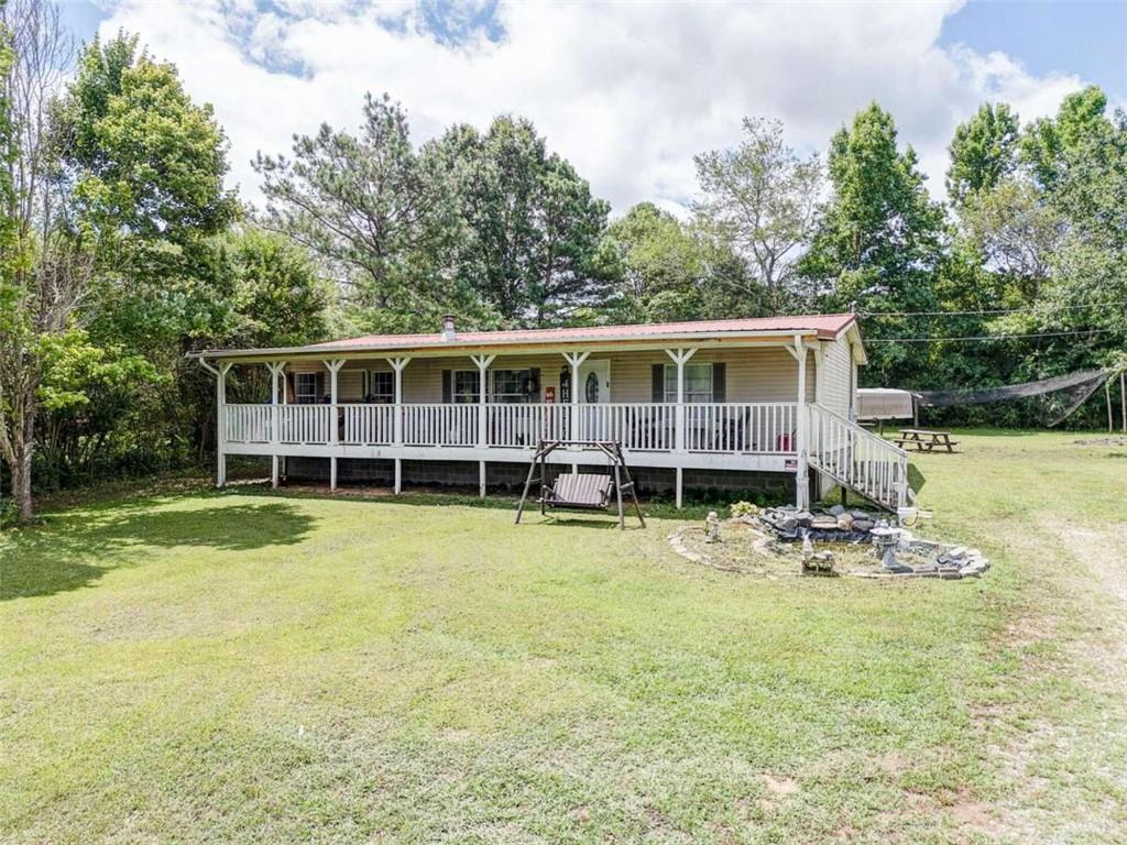 488 Wray Mine Road Buchanan, GA 30113 - Photo 1 of 1 a view of a house with swimming pool and sitting area