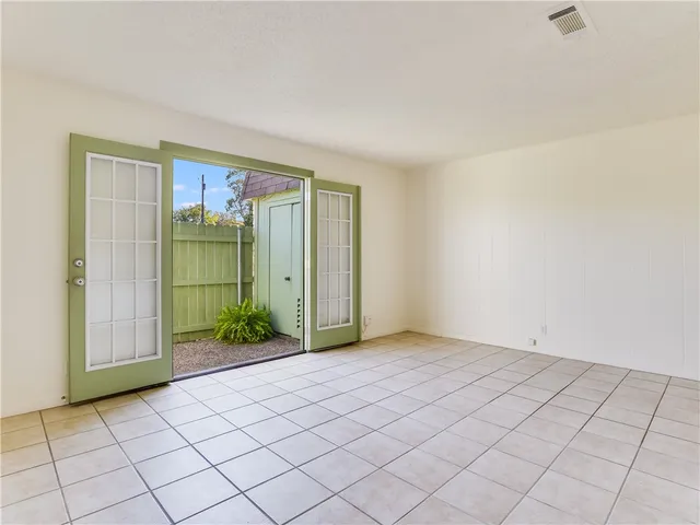a view of an empty room and window