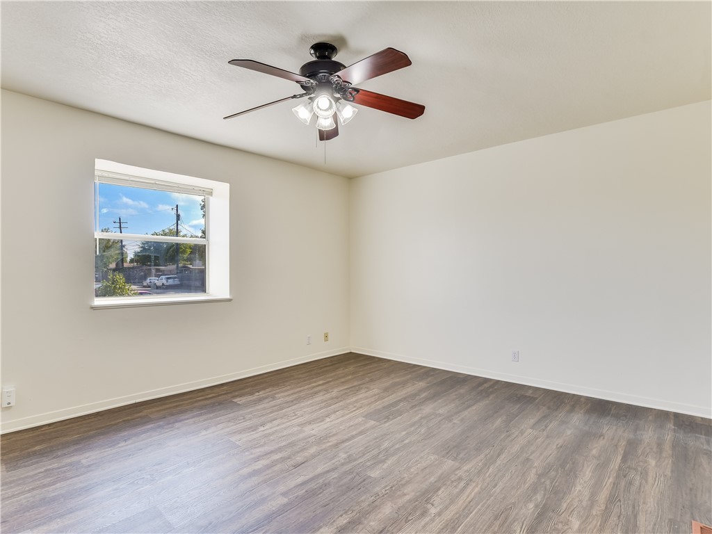 2804 Westhill Drive, Unit 101 Austin, TX 78704 - Photo 4 of 8 a view of an empty room with wooden floor