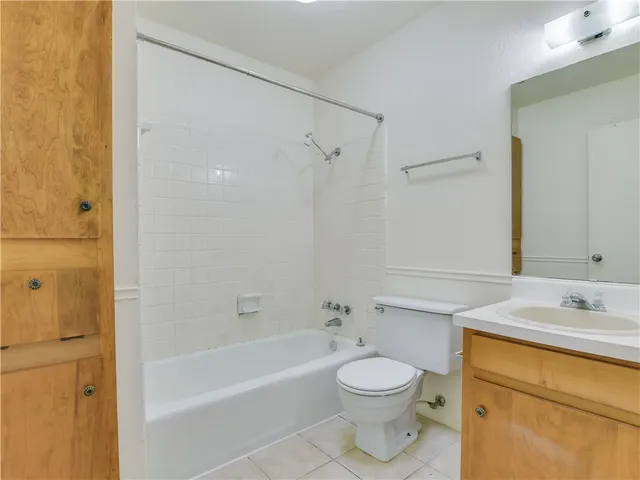 a bathroom with a toilet a sink and a bathtub