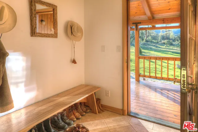 a room with wooden floor and a window